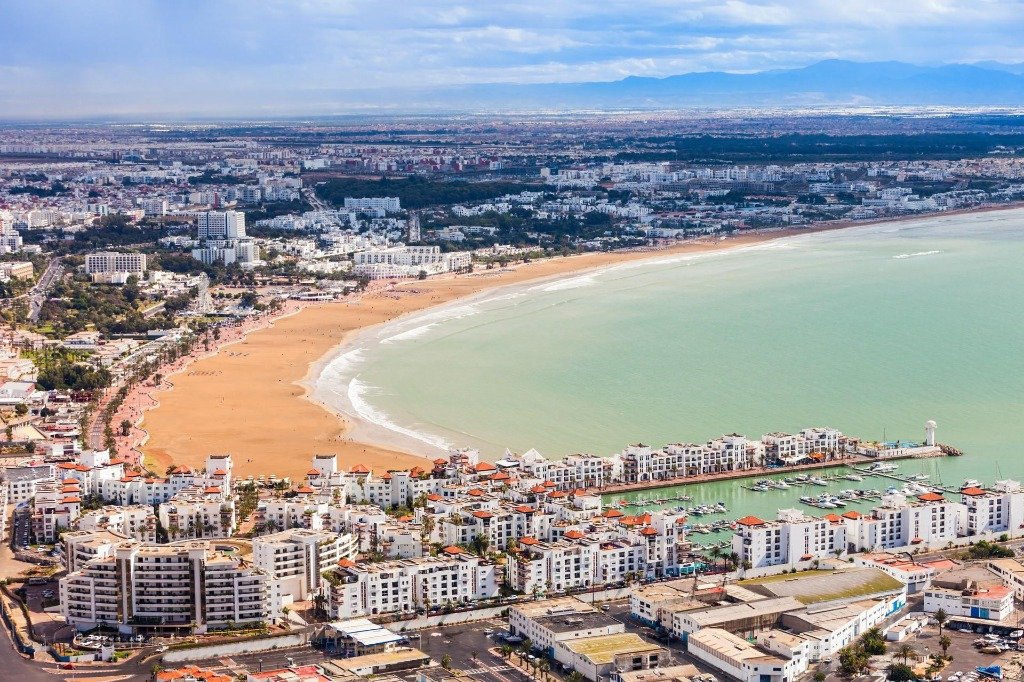 Aerial panoramic view of Agadir bay and long sandy beach - best time to visit Agadir for sunny weather